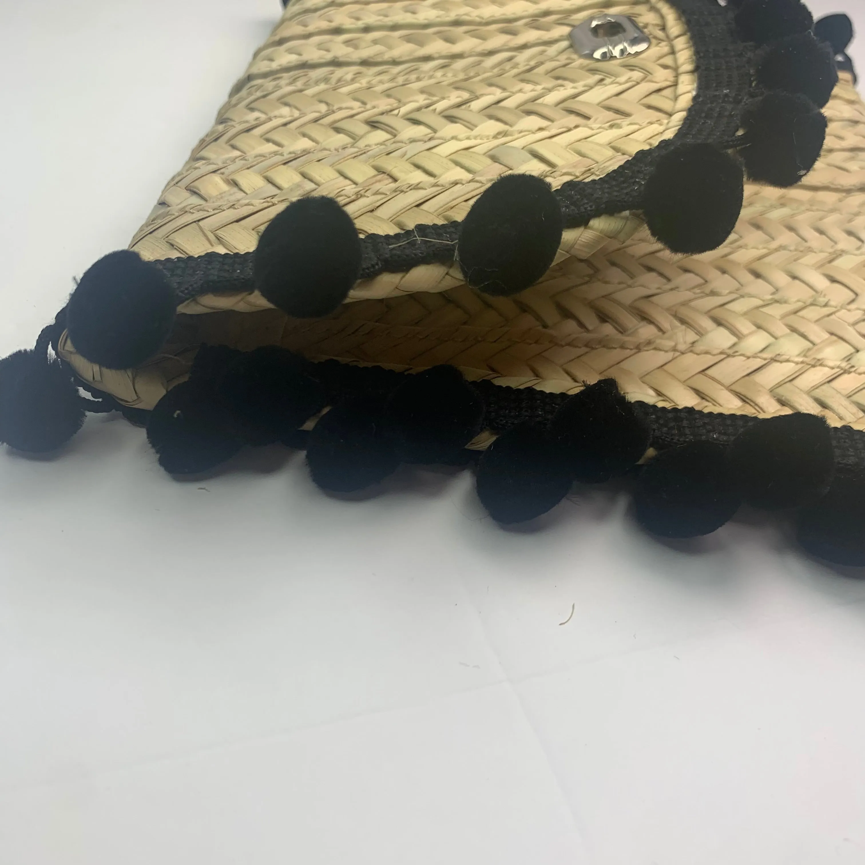 Penelope Black Pom Pom Trim Straw Clutch
